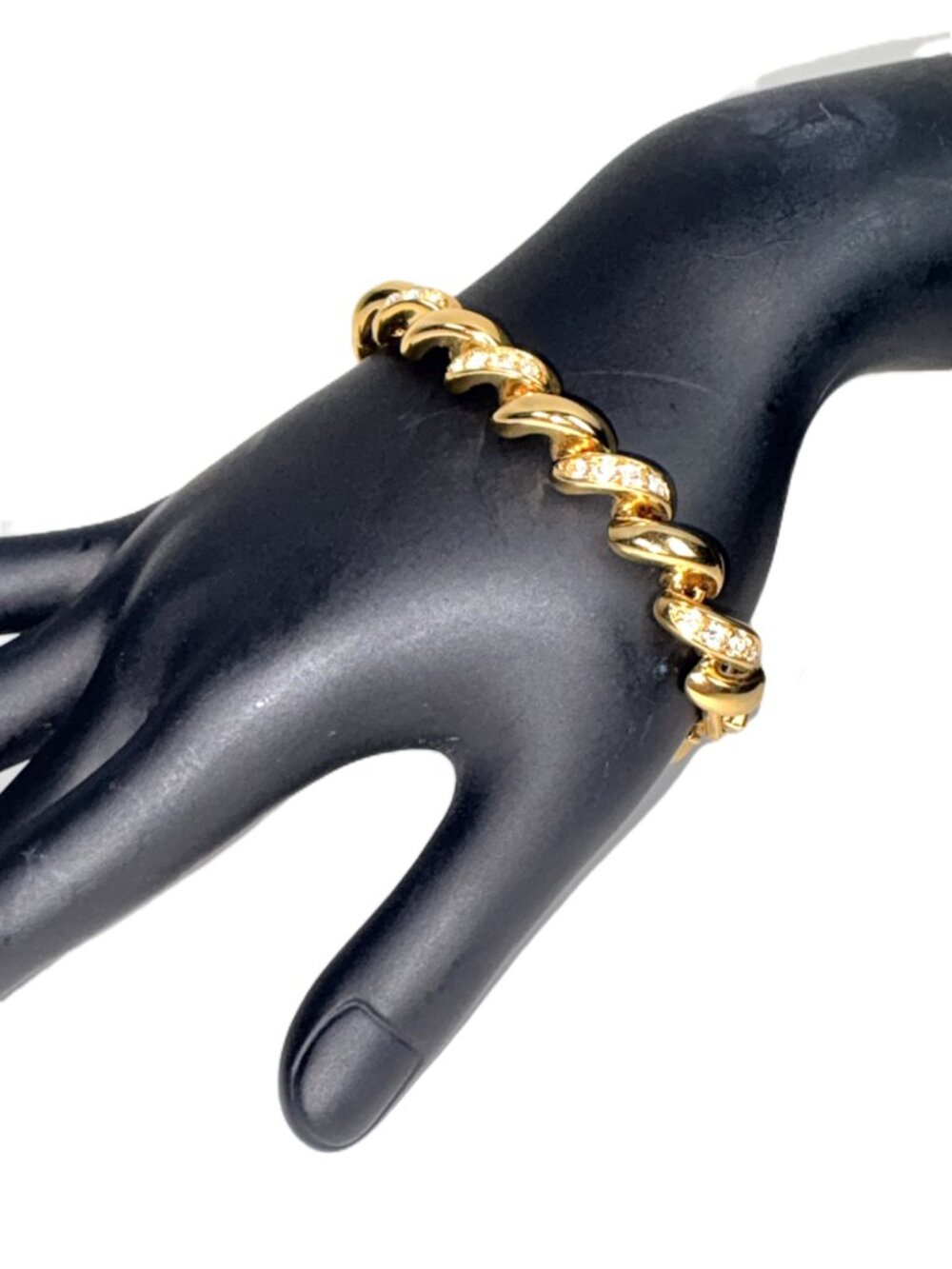 Elevate your jewelry selection with this elegant signed Monet vintage gold-tone